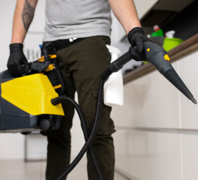 Person using a leaf blower indoors