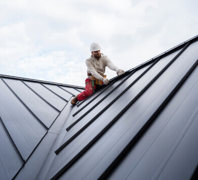 Roofer installing a flat roof